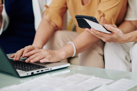 two people paying bills online