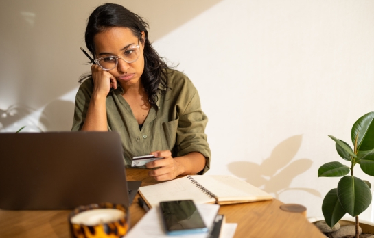 sad woman looking at card