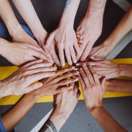 a group of hands together 