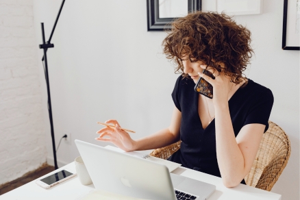 Woman on phone and computer