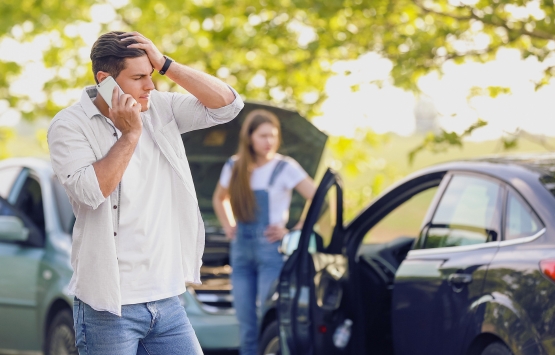 upset man in car crash
