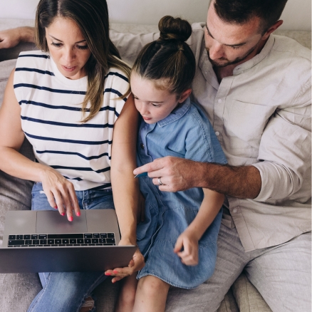 family looking at computer