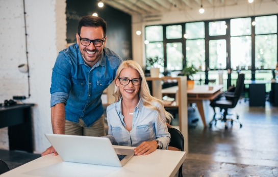 two people at an open office