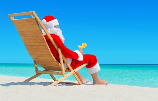 Santa in a lounge chair on the beach 