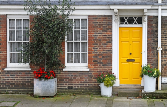 Brick house with yellow door