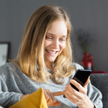 woman looking at phone app