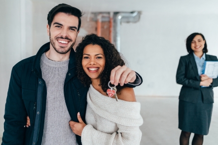 Young couple and real estate agent