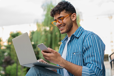 Business man using laptop and phone