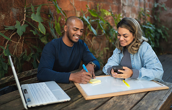 Two colleagues working on business plan