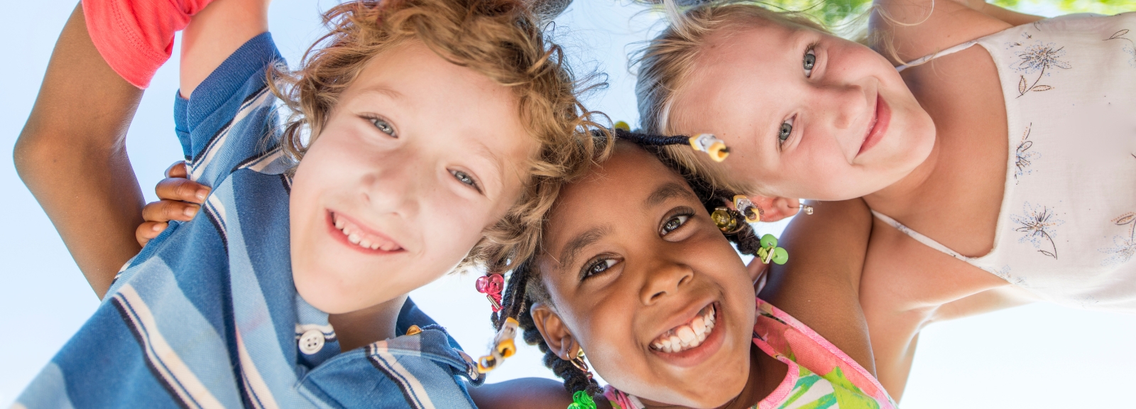 three kids looking at camera