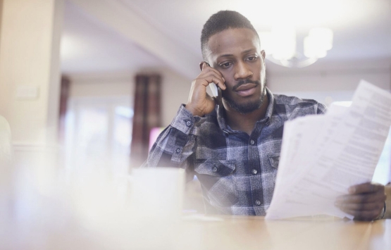 worried man on phone 