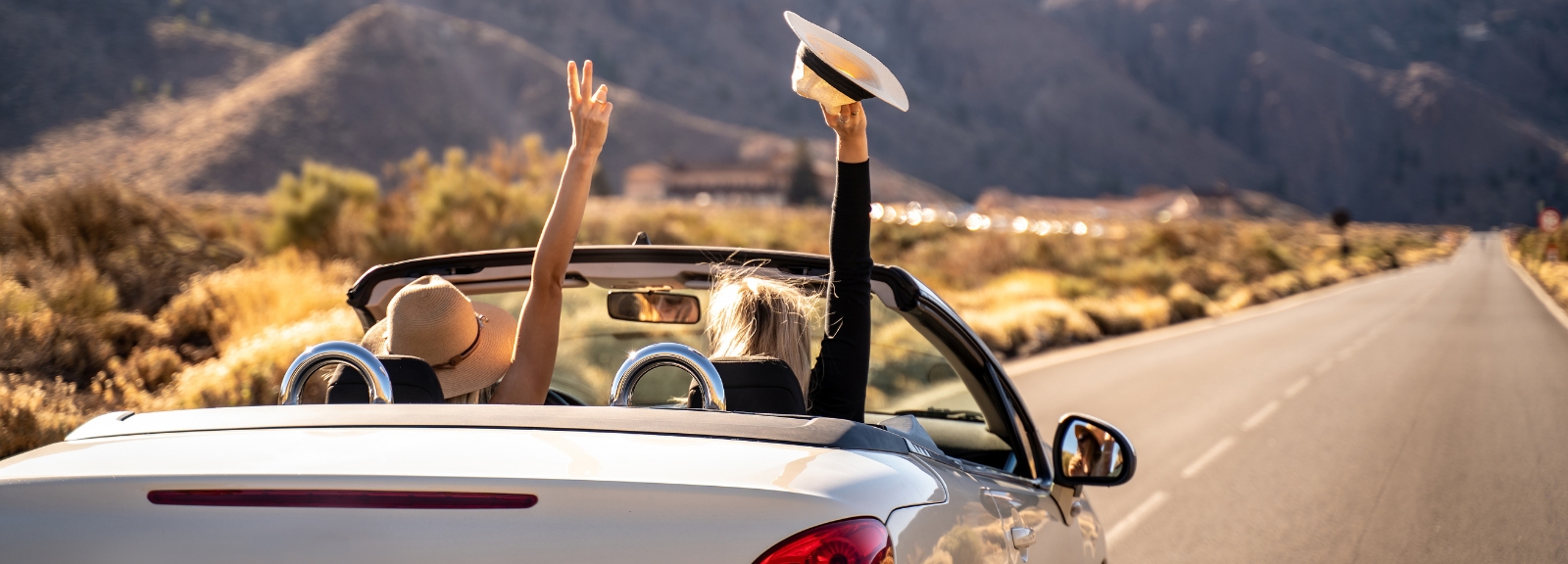 two people in convertable car