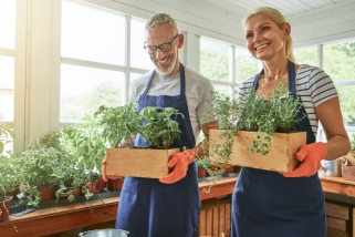 couple holding plants