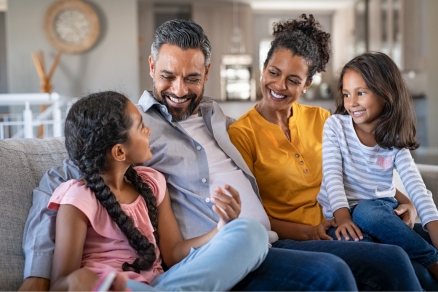 family of four on couch