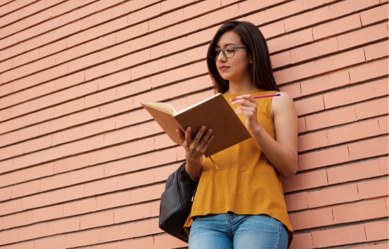 girl holding book