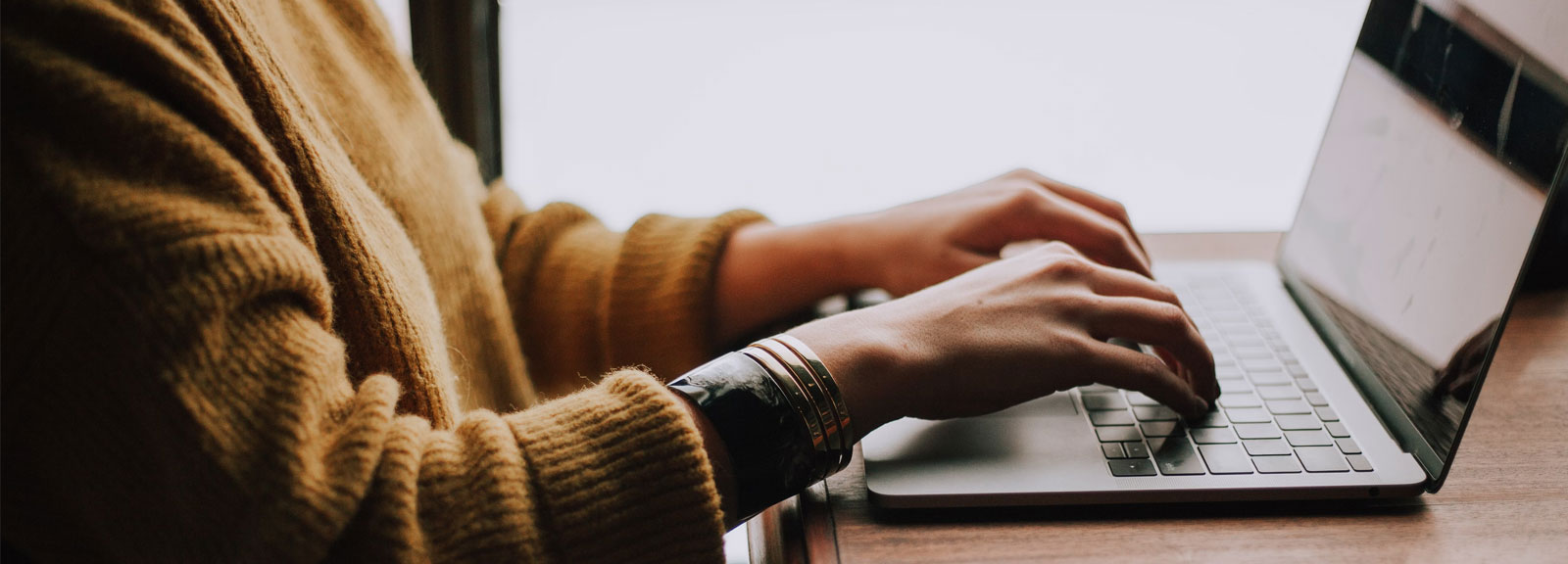 Close up of person using laptop