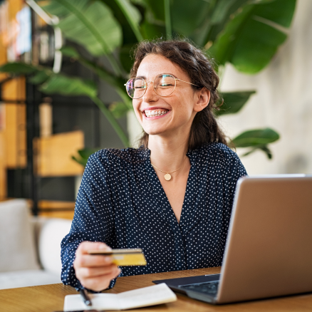 woman smiling holding card