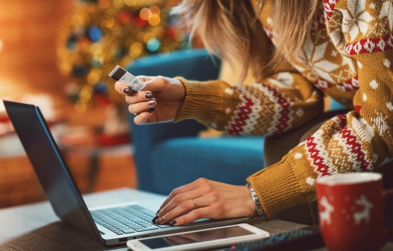 Woman holding credit card holidays