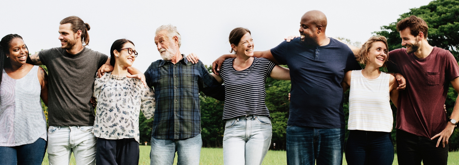 a group of people with arms around each other