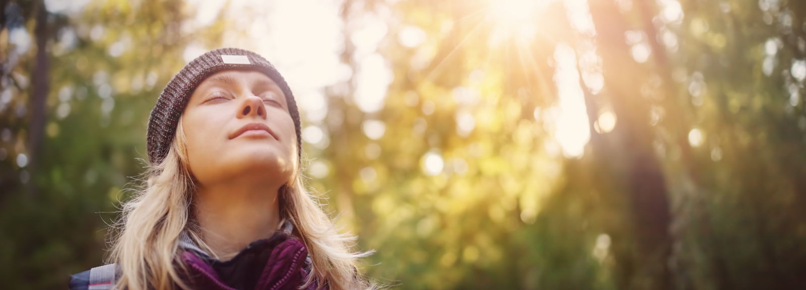 woman at peace in trees